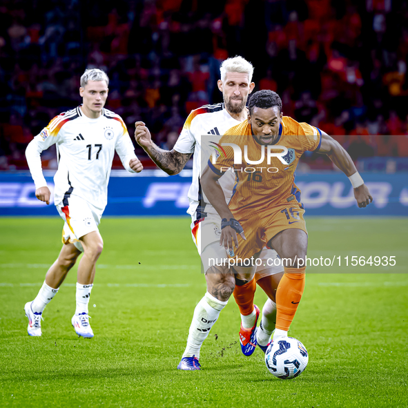 Germany midfielder Robert Andrich and Netherlands midfielder Quinten Timber during the match between the Netherlands and Germany at the Joha...