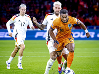 Germany midfielder Robert Andrich and Netherlands midfielder Quinten Timber during the match between the Netherlands and Germany at the Joha...