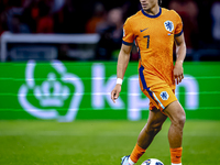 Netherlands midfielder Xavi Simons plays during the match between the Netherlands and Germany at the Johan Cruijff ArenA for the UEFA Nation...