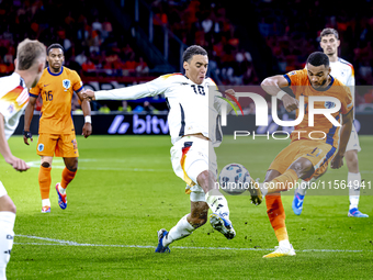 Germany midfielder Jamal Musiala and Netherlands forward Cody Gakpo during the match between the Netherlands and Germany at the Johan Cruijf...