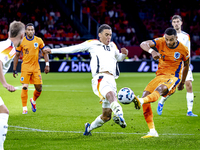 Germany midfielder Jamal Musiala and Netherlands forward Cody Gakpo during the match between the Netherlands and Germany at the Johan Cruijf...