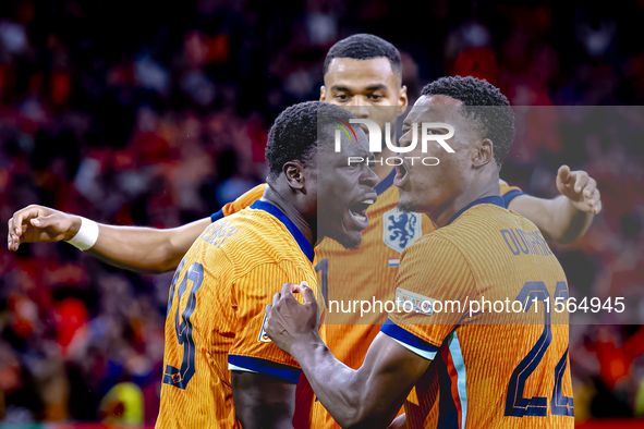 Netherlands forward Brian Brobbey and Netherlands defender Denzel Dumfries celebrate the goal during the match between the Netherlands and G...