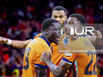 Netherlands forward Brian Brobbey and Netherlands defender Denzel Dumfries celebrate the goal during the match between the Netherlands and G...