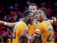 Netherlands forward Brian Brobbey and Netherlands defender Denzel Dumfries celebrate the goal during the match between the Netherlands and G...