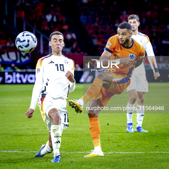 Germany midfielder Jamal Musiala and Netherlands forward Cody Gakpo during the match between the Netherlands and Germany at the Johan Cruijf...