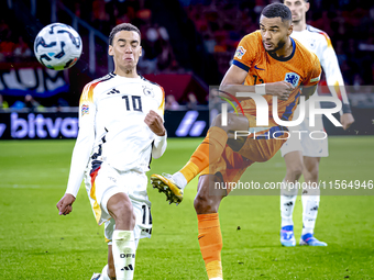 Germany midfielder Jamal Musiala and Netherlands forward Cody Gakpo during the match between the Netherlands and Germany at the Johan Cruijf...