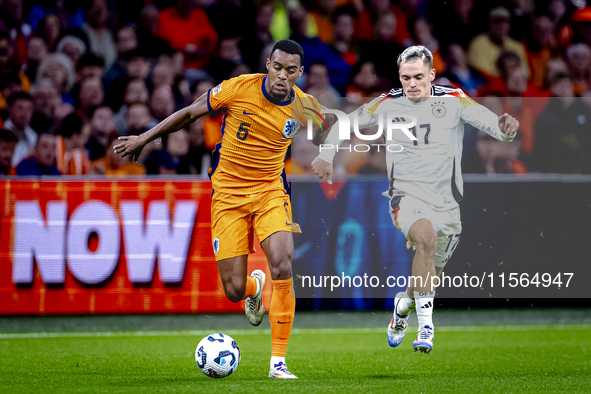 Netherlands midfielder Ryan Gravenberch and Germany midfielder Florian Wirtz during the match between the Netherlands and Germany at the Joh...