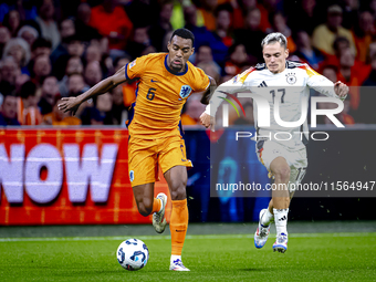 Netherlands midfielder Ryan Gravenberch and Germany midfielder Florian Wirtz during the match between the Netherlands and Germany at the Joh...