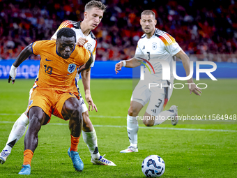 Germany defender Nico Schlotterbeck and Netherlands forward Brian Brobbey during the match between Netherlands and Germany at the Johan Crui...