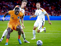 Germany defender Nico Schlotterbeck and Netherlands forward Brian Brobbey during the match between Netherlands and Germany at the Johan Crui...