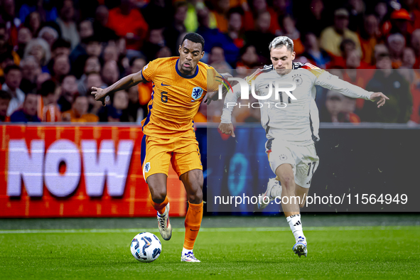 Netherlands midfielder Ryan Gravenberch and Germany midfielder Florian Wirtz during the match between the Netherlands and Germany at the Joh...