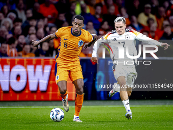 Netherlands midfielder Ryan Gravenberch and Germany midfielder Florian Wirtz during the match between the Netherlands and Germany at the Joh...