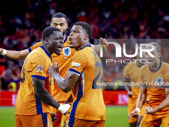 Netherlands forward Brian Brobbey and Netherlands defender Denzel Dumfries celebrate the goal during the match between the Netherlands and G...