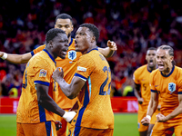 Netherlands forward Brian Brobbey and Netherlands defender Denzel Dumfries celebrate the goal during the match between the Netherlands and G...