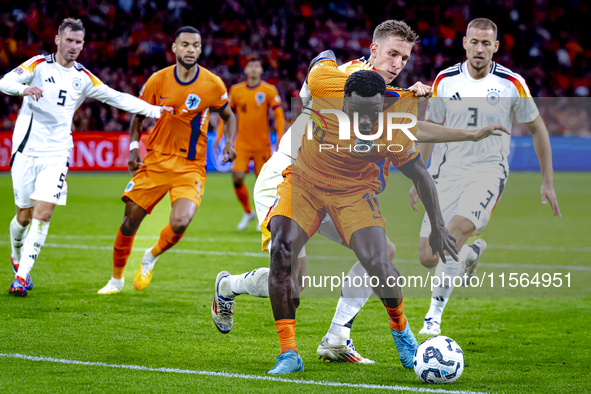 Germany defender Nico Schlotterbeck and Netherlands forward Brian Brobbey during the match between Netherlands and Germany at the Johan Crui...