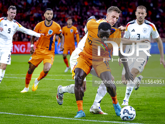 Germany defender Nico Schlotterbeck and Netherlands forward Brian Brobbey during the match between Netherlands and Germany at the Johan Crui...