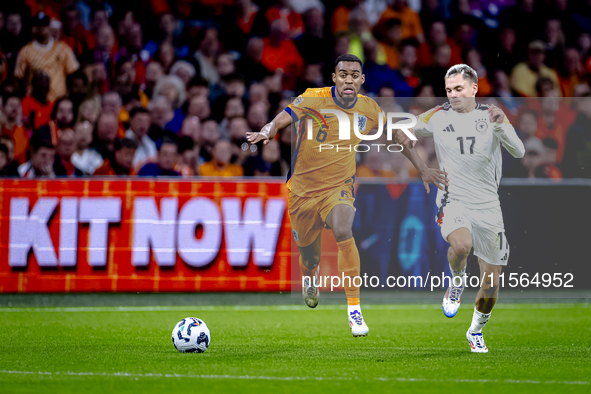 Netherlands midfielder Ryan Gravenberch and Germany midfielder Florian Wirtz during the match between the Netherlands and Germany at the Joh...