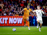 Netherlands midfielder Ryan Gravenberch and Germany midfielder Florian Wirtz during the match between the Netherlands and Germany at the Joh...