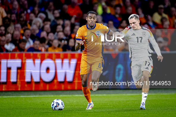 Netherlands midfielder Ryan Gravenberch and Germany midfielder Florian Wirtz during the match between the Netherlands and Germany at the Joh...