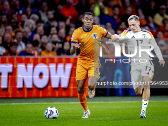 Netherlands midfielder Ryan Gravenberch and Germany midfielder Florian Wirtz during the match between the Netherlands and Germany at the Joh...