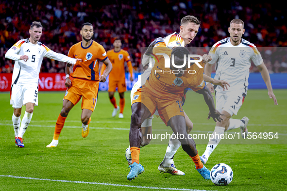 Germany defender Nico Schlotterbeck and Netherlands forward Brian Brobbey during the match between Netherlands and Germany at the Johan Crui...