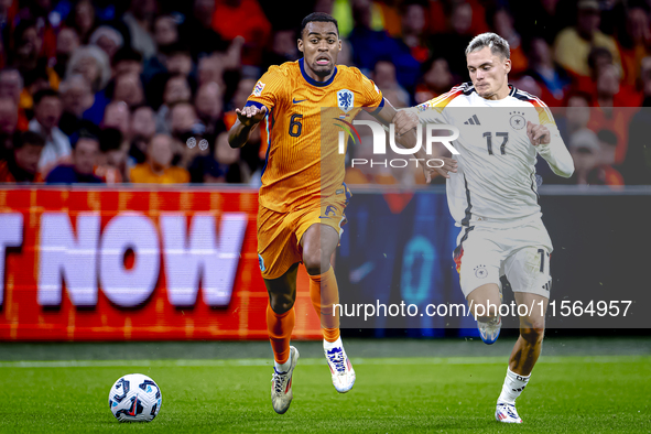 Netherlands midfielder Ryan Gravenberch and Germany midfielder Florian Wirtz during the match between the Netherlands and Germany at the Joh...