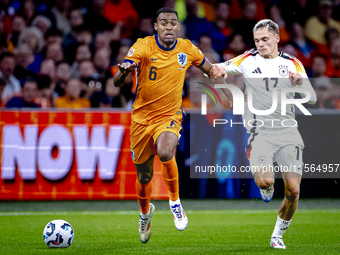 Netherlands midfielder Ryan Gravenberch and Germany midfielder Florian Wirtz during the match between the Netherlands and Germany at the Joh...