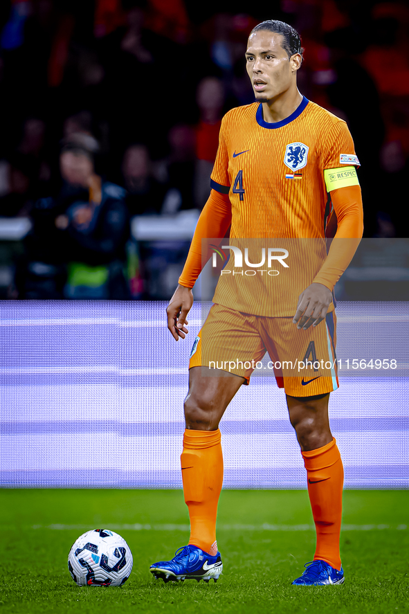 Netherlands defender Virgil van Dijk plays during the match between the Netherlands and Germany at the Johan Cruijff ArenA for the UEFA Nati...