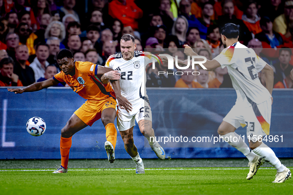 Netherlands defender Denzel Dumfries and Germany defender David Raum during the match between the Netherlands and Germany at the Johan Cruij...