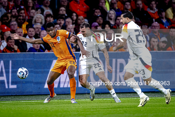 Netherlands defender Denzel Dumfries and Germany defender David Raum during the match between the Netherlands and Germany at the Johan Cruij...