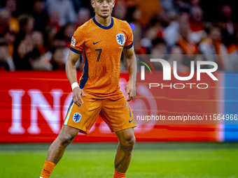 Netherlands midfielder Xavi Simons plays during the match between the Netherlands and Germany at the Johan Cruijff ArenA for the UEFA Nation...