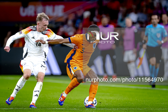 Germany forward Maximillian Beier and Netherlands defender Jurrien Timber during the match between the Netherlands and Germany at the Johan...