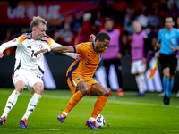 Germany forward Maximillian Beier and Netherlands defender Jurrien Timber during the match between the Netherlands and Germany at the Johan...