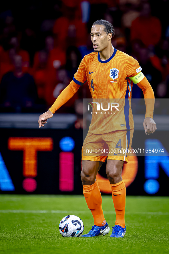 Netherlands defender Virgil van Dijk plays during the match between the Netherlands and Germany at the Johan Cruijff ArenA for the UEFA Nati...