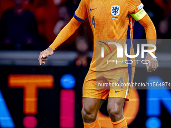 Netherlands defender Virgil van Dijk plays during the match between the Netherlands and Germany at the Johan Cruijff ArenA for the UEFA Nati...