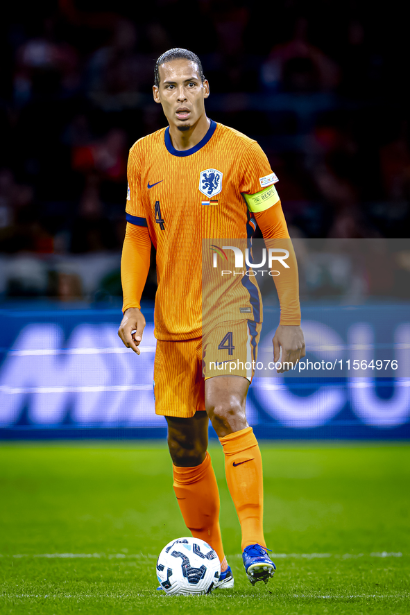 Netherlands defender Virgil van Dijk plays during the match between the Netherlands and Germany at the Johan Cruijff ArenA for the UEFA Nati...