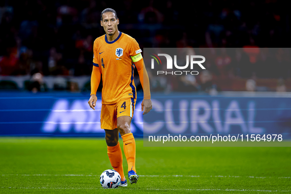 Netherlands defender Virgil van Dijk plays during the match between the Netherlands and Germany at the Johan Cruijff ArenA for the UEFA Nati...