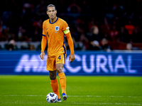 Netherlands defender Virgil van Dijk plays during the match between the Netherlands and Germany at the Johan Cruijff ArenA for the UEFA Nati...