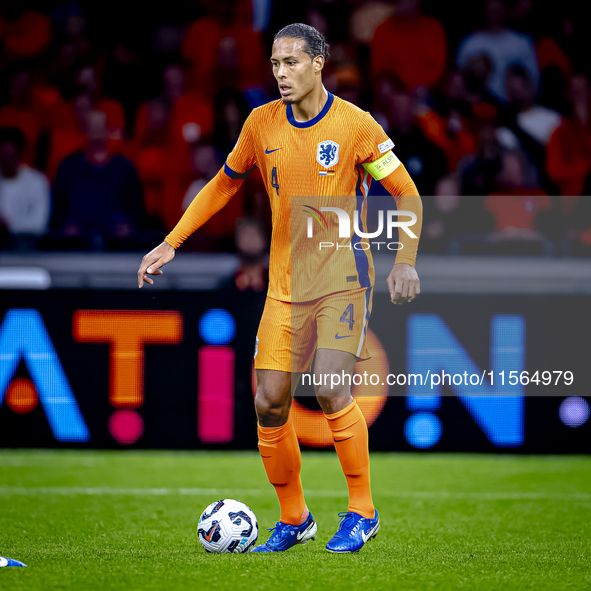 Netherlands defender Virgil van Dijk plays during the match between the Netherlands and Germany at the Johan Cruijff ArenA for the UEFA Nati...