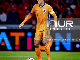 Netherlands defender Virgil van Dijk plays during the match between the Netherlands and Germany at the Johan Cruijff ArenA for the UEFA Nati...