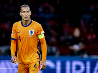 Netherlands defender Virgil van Dijk plays during the match between the Netherlands and Germany at the Johan Cruijff ArenA for the UEFA Nati...