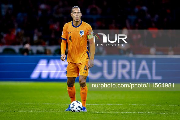 Netherlands defender Virgil van Dijk plays during the match between the Netherlands and Germany at the Johan Cruijff ArenA for the UEFA Nati...