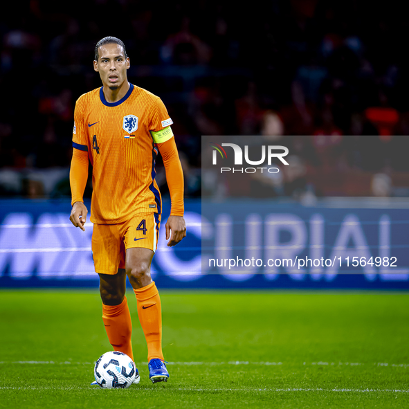 Netherlands defender Virgil van Dijk plays during the match between the Netherlands and Germany at the Johan Cruijff ArenA for the UEFA Nati...