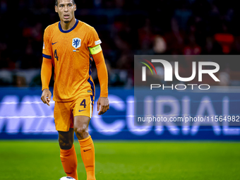 Netherlands defender Virgil van Dijk plays during the match between the Netherlands and Germany at the Johan Cruijff ArenA for the UEFA Nati...