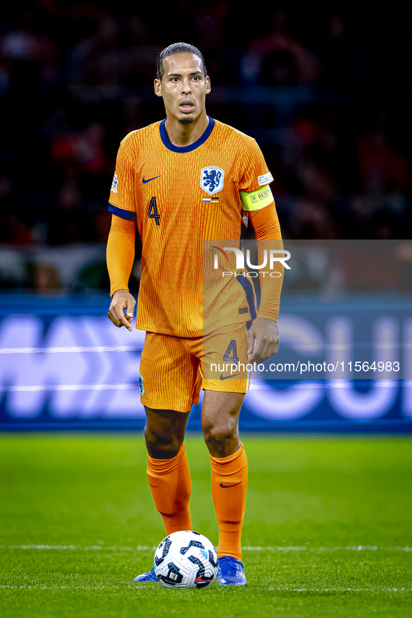 Netherlands defender Virgil van Dijk plays during the match between the Netherlands and Germany at the Johan Cruijff ArenA for the UEFA Nati...