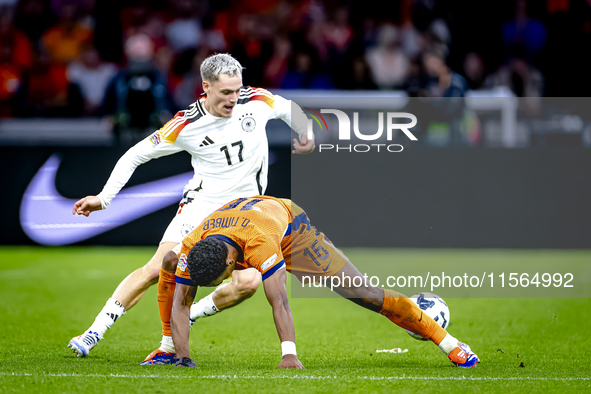 Germany forward Kai Havertz and Netherlands midfielder Quinten Timber during the match between the Netherlands and Germany at the Johan Crui...