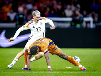 Germany forward Kai Havertz and Netherlands midfielder Quinten Timber during the match between the Netherlands and Germany at the Johan Crui...