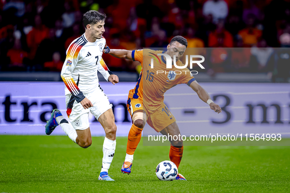 Germany forward Kai Havertz and Netherlands midfielder Quinten Timber during the match between the Netherlands and Germany at the Johan Crui...