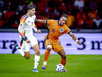 Germany forward Kai Havertz and Netherlands midfielder Quinten Timber during the match between the Netherlands and Germany at the Johan Crui...