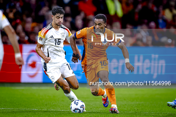 Germany midfielder Aleksander Pavlovic and Netherlands midfielder Quinten Timber during the match between the Netherlands and Germany at the...